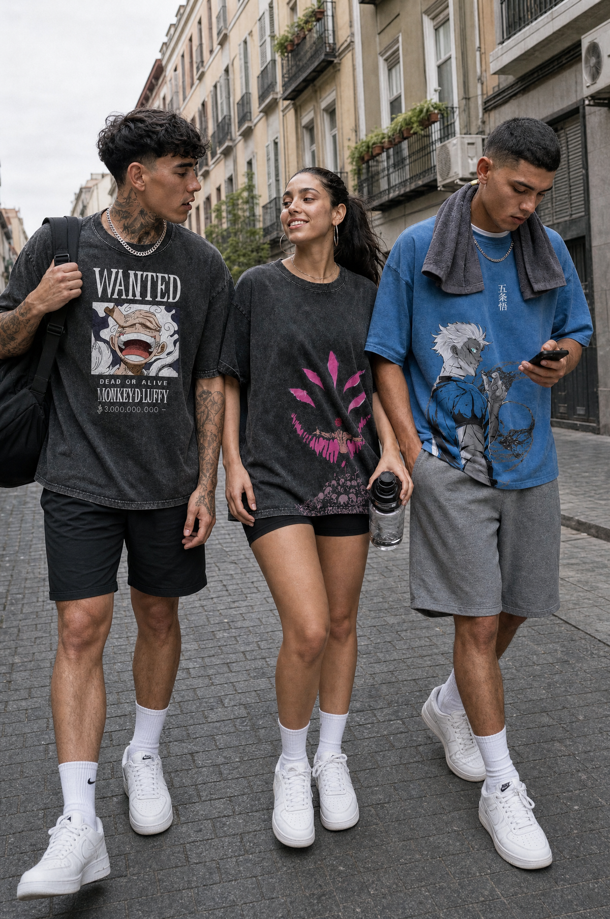 Three friends walking down a Madrid street after training, wearing ByShonen tees